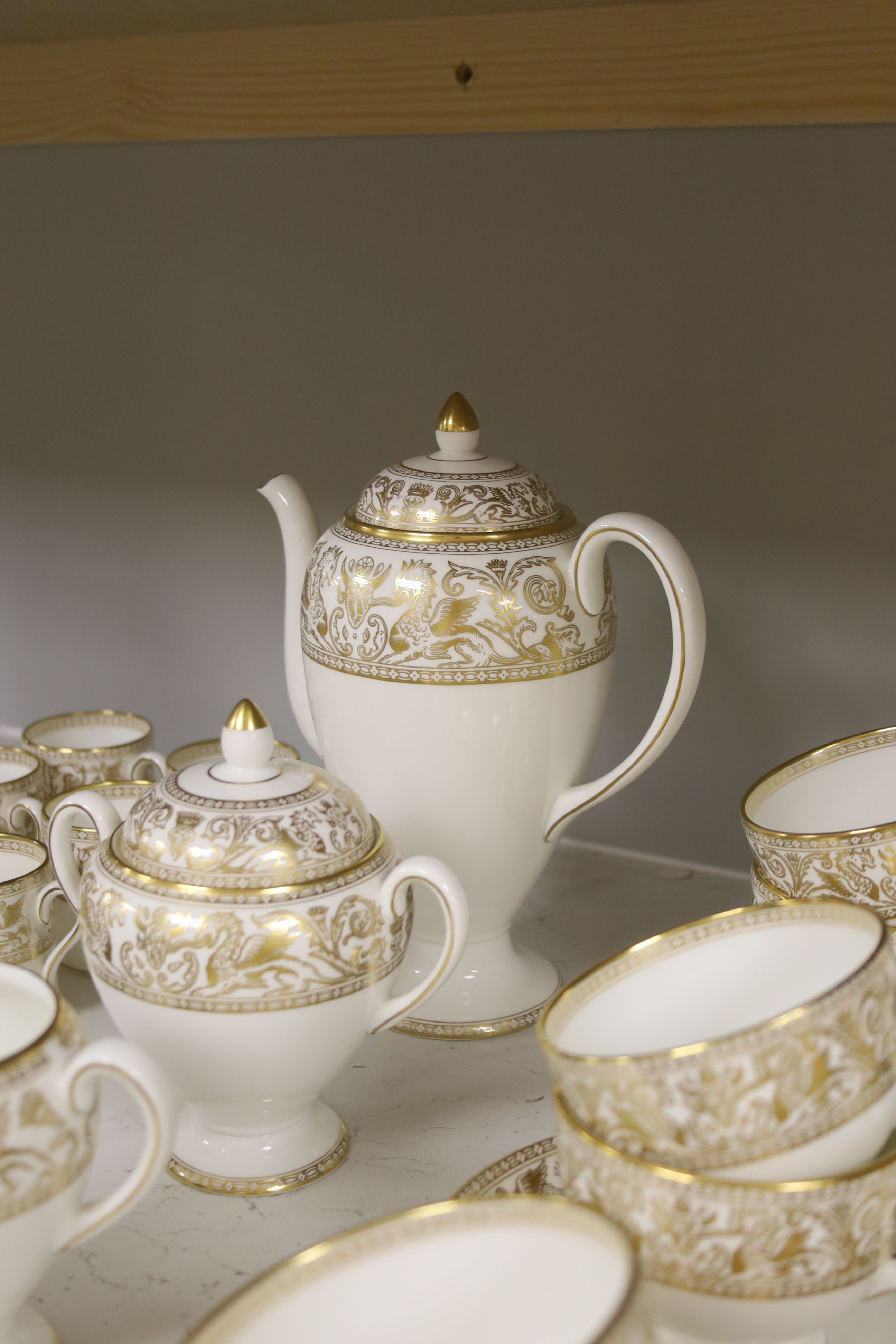 A Wedgwood Gold florentine pattern part tea coffee and dinner service